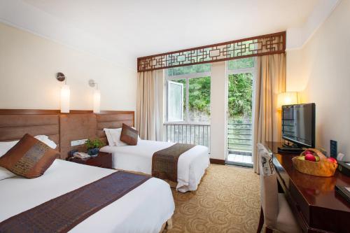 Imagen de la habitación del Hotel Huangshan Jinpu Dongyi. Foto 7