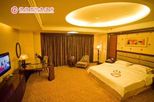 Imagen de la habitación del Hotel Huangzu International. Foto 8