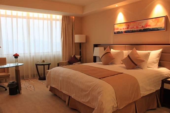Imagen de la habitación del Hotel Huaqiao New Century Grand. Foto 2