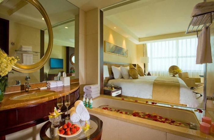 Imagen de la habitación del Hotel Huaqiao New Century Grand. Foto 4