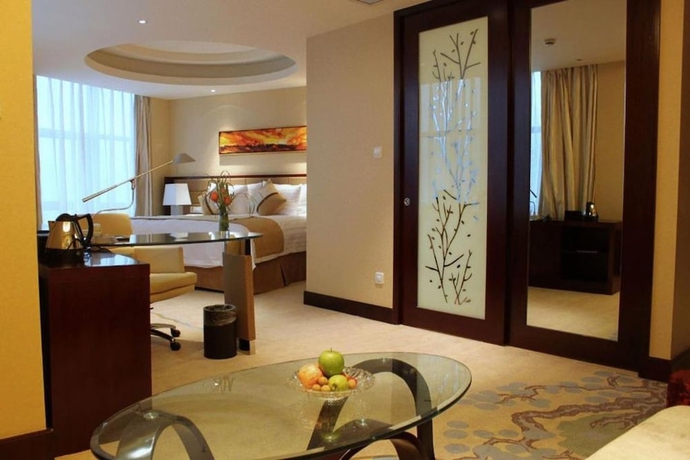 Imagen de la habitación del Hotel Huaqiao New Century Grand. Foto 5
