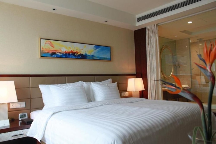 Imagen de la habitación del Hotel Huaqiao New Century Grand. Foto 7