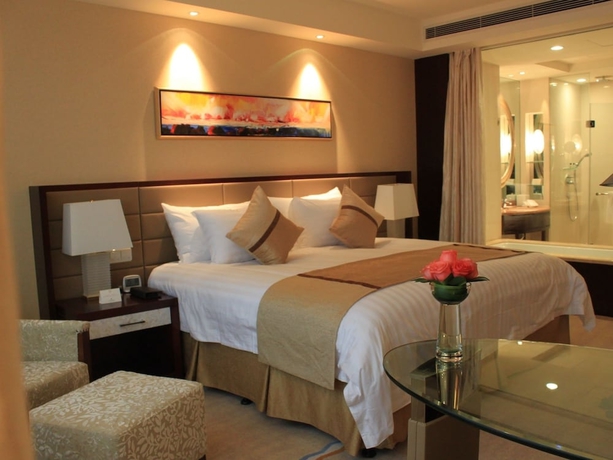 Imagen de la habitación del Hotel Huaqiao New Century Grand. Foto 8