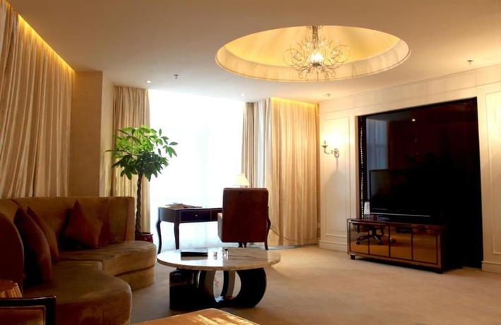 Imagen de la habitación del Hotel Huaqiao New Century Grand. Foto 10