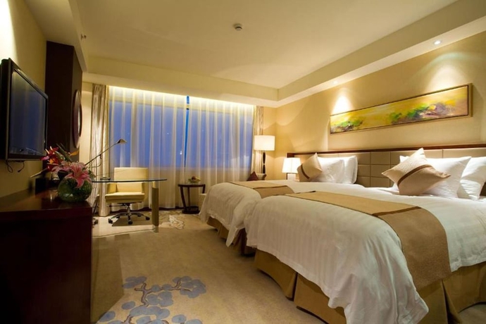 Imagen de la habitación del Hotel Huaqiao New Century Grand. Foto 12