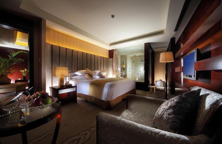 Imagen de la habitación del Hotel Huaqiao New Century Grand. Foto 13