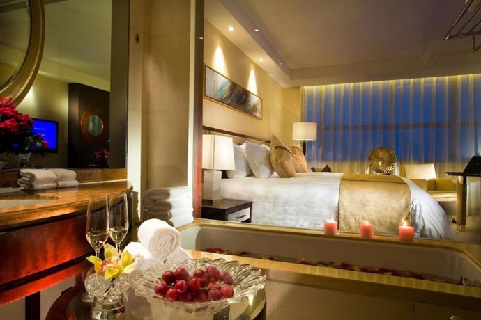 Imagen de la habitación del Hotel Huaqiao New Century Grand. Foto 14