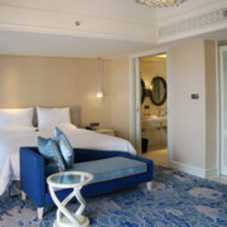 Imagen de la habitación del Hotel Huaqing Aegean Inter Hot Spring Resort. Foto 9