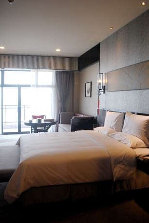 Imagen de la habitación del Hotel Huaqing Aegean Inter Hot Spring Resort. Foto 13