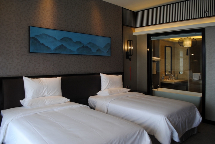 Imagen de la habitación del Hotel Huaqing Aegean Inter Hot Spring Resort. Foto 14