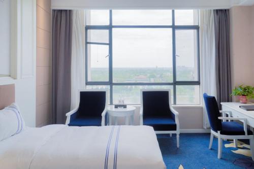 Imagen de la habitación del Hotel Huashan Xinyuan International. Foto 19