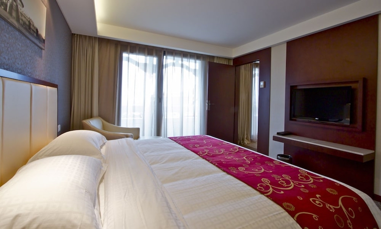 Imagen de la habitación del Hotel Huatian Chinagora. Foto 17