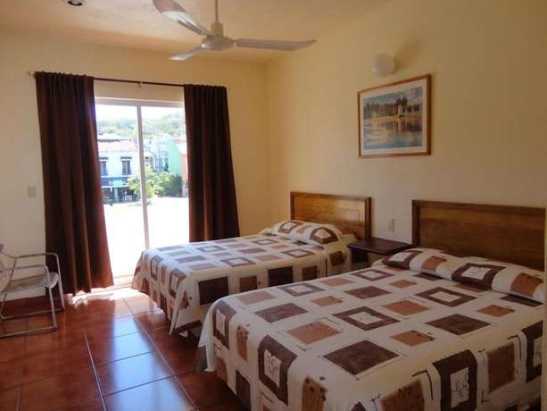 Imagen de la habitación del Hotel Huatulco Maxico. Foto 8