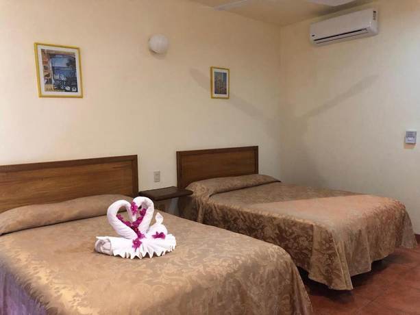 Imagen de la habitación del Hotel Huatulco Maxico. Foto 12