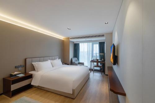 Imagen general del Hotel Huawen Four Season. Foto 6