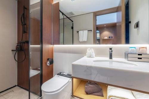 Imagen de la habitación del Hotel Huawen Four Season. Foto 18