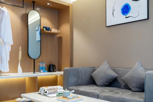 Imagen de la habitación del Hotel Huawen Four Season. Foto 19