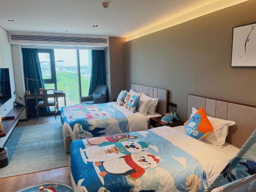 Imagen de la habitación del Hotel Huawen Four Season. Foto 20