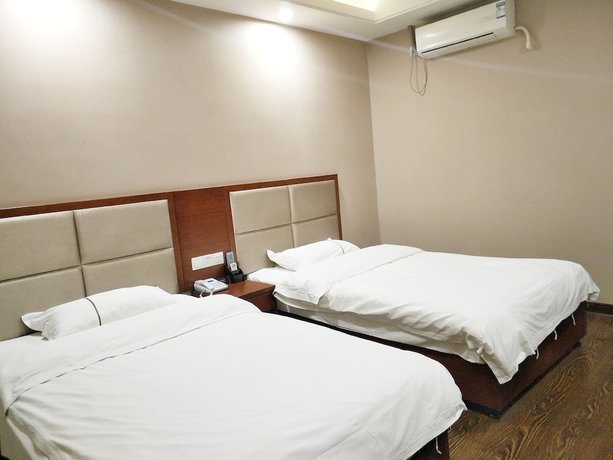 Imagen de la habitación del Hotel Huaxi. Foto 4