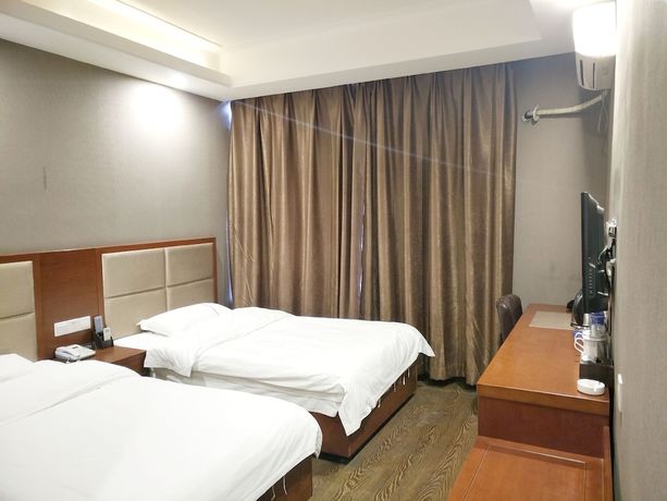 Imagen de la habitación del Hotel Huaxi. Foto 5