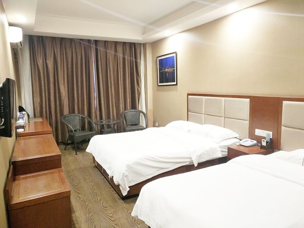 Imagen de la habitación del Hotel Huaxi. Foto 8