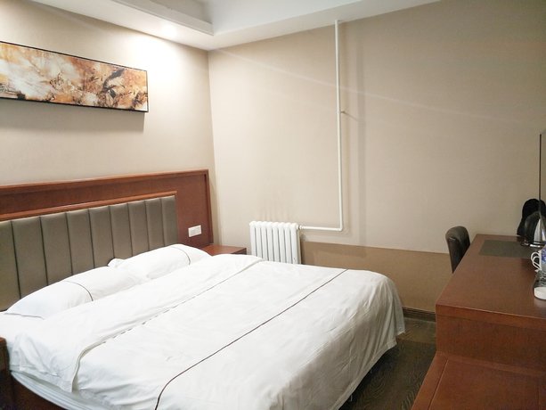 Imagen de la habitación del Hotel Huaxi. Foto 9