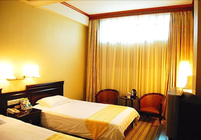 Imagen de la habitación del Hotel Huaxia Hotel. Foto 5