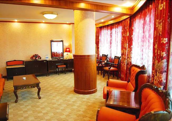 Imagen de la habitación del Hotel Huaxia Hotel. Foto 7