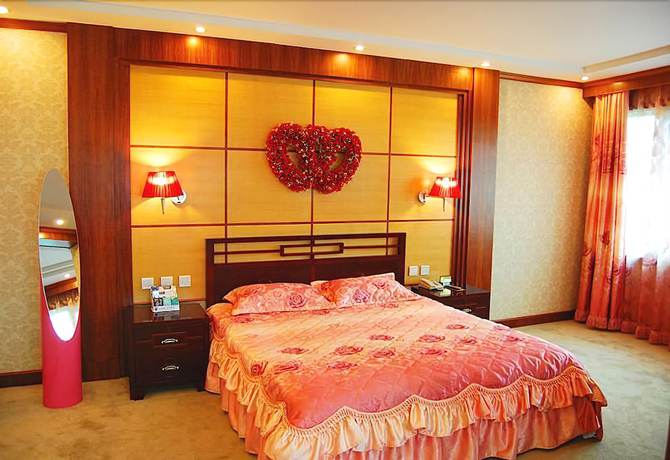 Imagen de la habitación del Hotel Huaxia Hotel. Foto 9