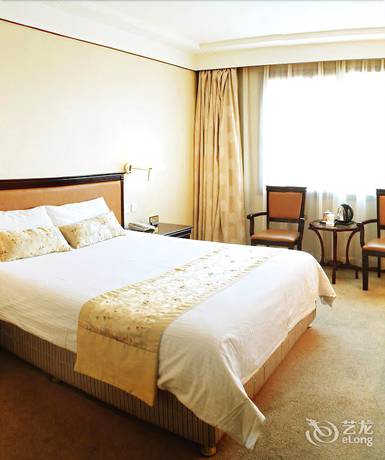 Imagen de la habitación del Hotel Huaxia Hotel. Foto 10