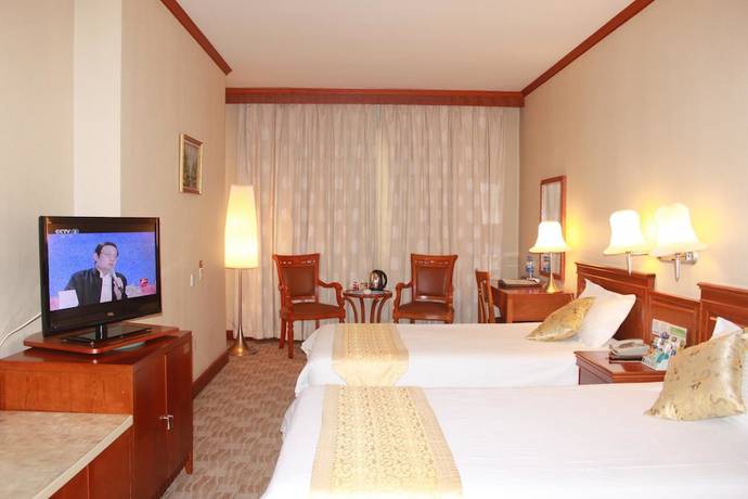 Imagen de la habitación del Hotel Huaxia Hotel. Foto 12