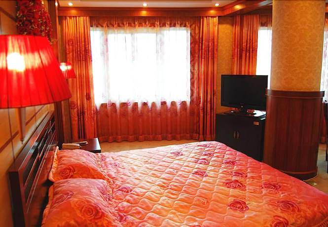 Imagen de la habitación del Hotel Huaxia Hotel. Foto 13