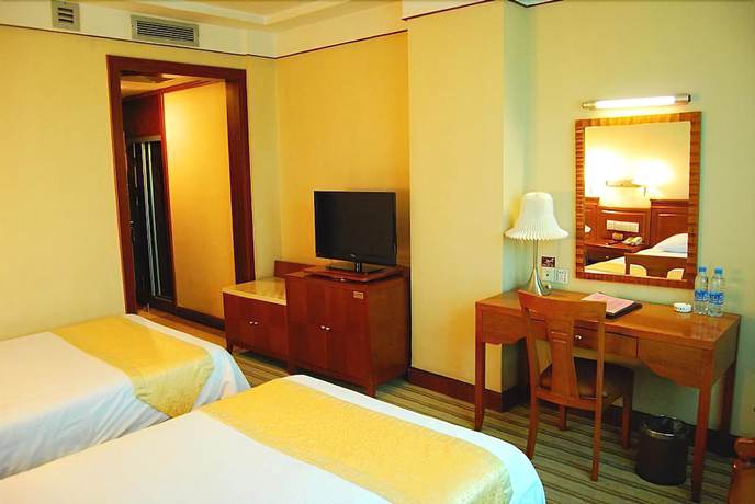 Imagen de la habitación del Hotel Huaxia Hotel. Foto 14