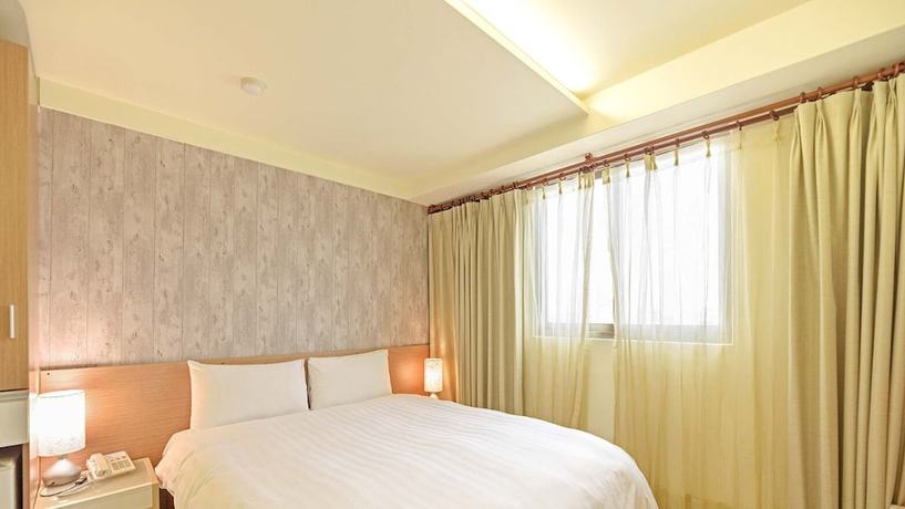 Imagen de la habitación del Hotel Huaxin. Foto 11