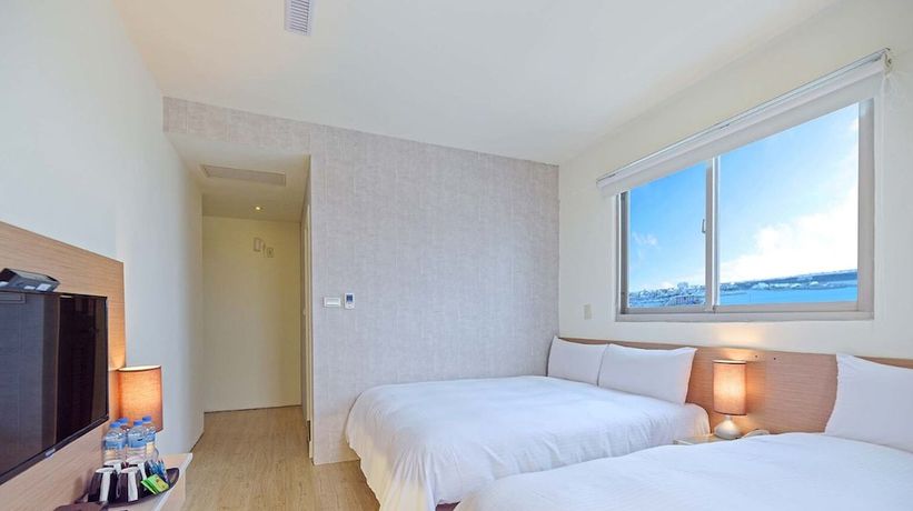 Imagen de la habitación del Hotel Huaxin. Foto 12