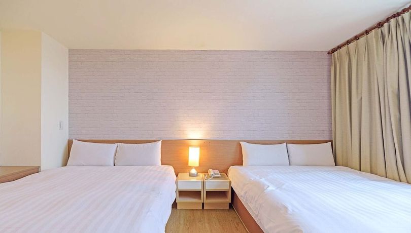 Imagen de la habitación del Hotel Huaxin. Foto 13