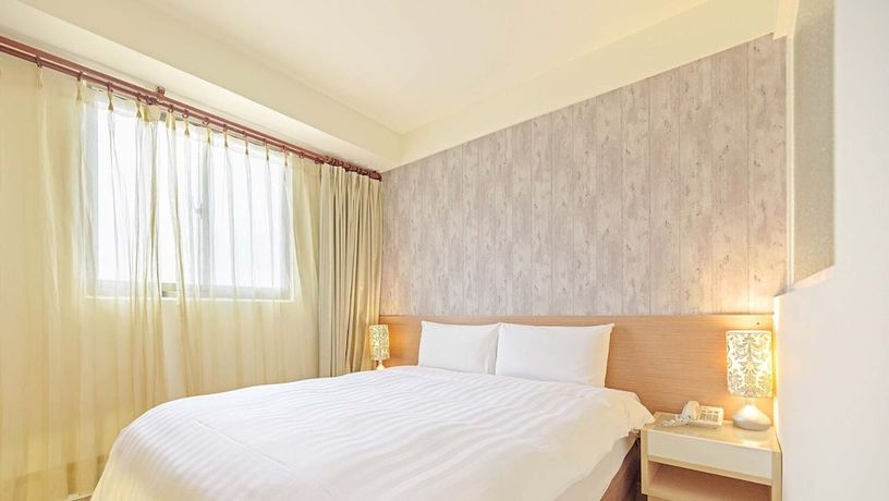 Imagen de la habitación del Hotel Huaxin. Foto 14