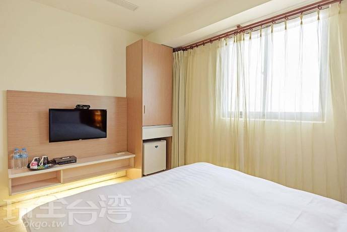 Imagen de la habitación del Hotel Huaxin. Foto 17