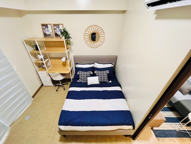 Imagen de la habitación del Hotel Hubomoto Megaworld Suites. Foto 2