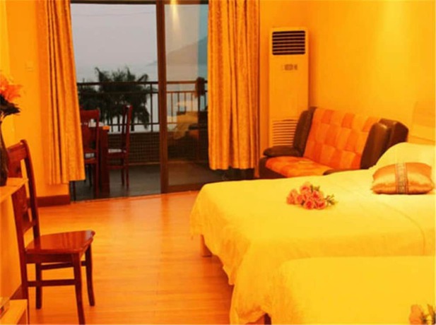 Imagen de la habitación del Hotel Huidong Ganghui Holiday. Foto 8