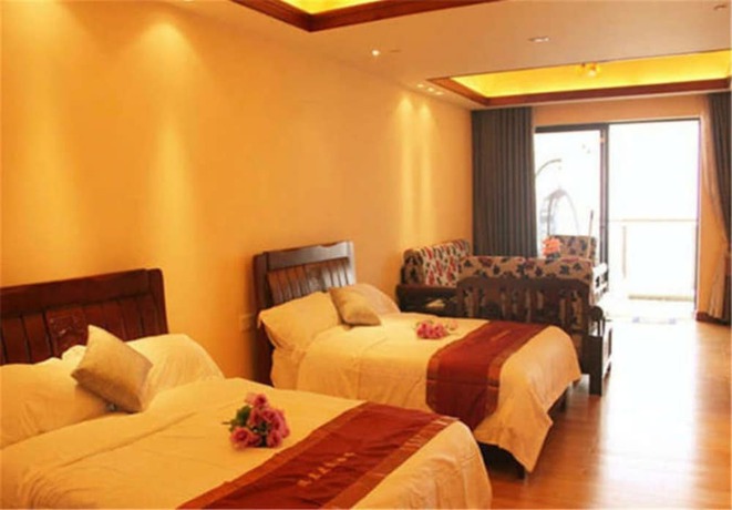 Imagen de la habitación del Hotel Huidong Ganghui Holiday. Foto 10