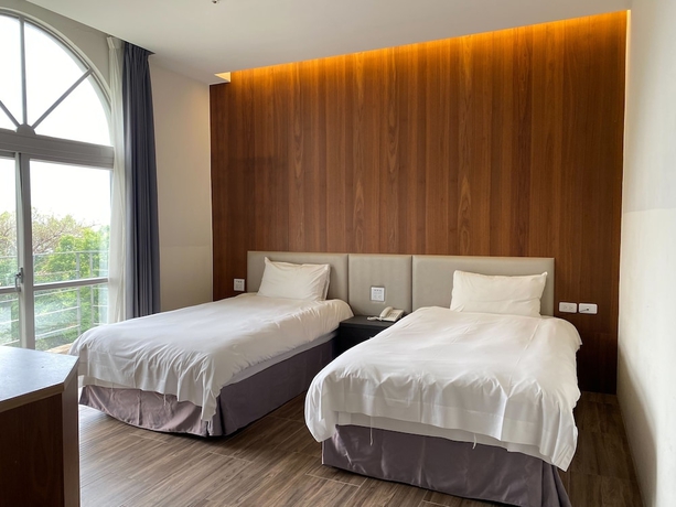 Imagen de la habitación del Hotel Huilan Edu. Foto 8