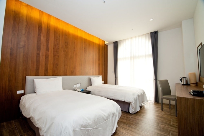 Imagen de la habitación del Hotel Huilan Edu. Foto 9