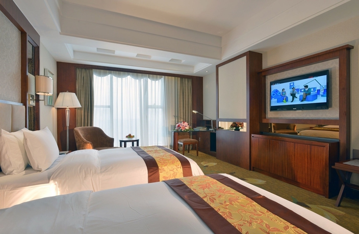 Imagen de la habitación del Hotel Huilihua. Foto 12