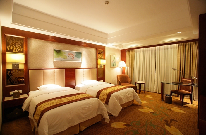 Imagen de la habitación del Hotel Huilihua. Foto 14