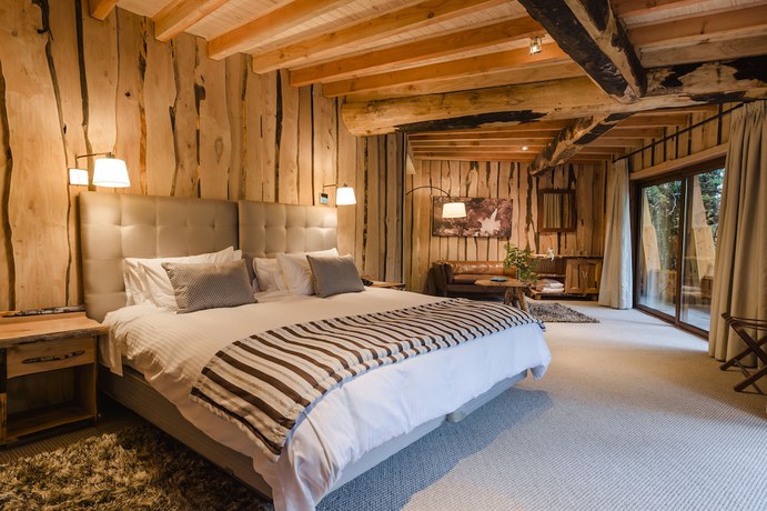 Imagen de la habitación del Hotel Huilo Huilo Reino Fungi. Foto 11