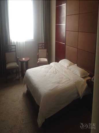 Imagen de la habitación del Hotel Huiquan Boutique Hotel. Foto 4