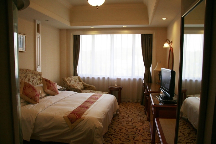 Imagen de la habitación del Hotel Huiquan Dynasty. Foto 3
