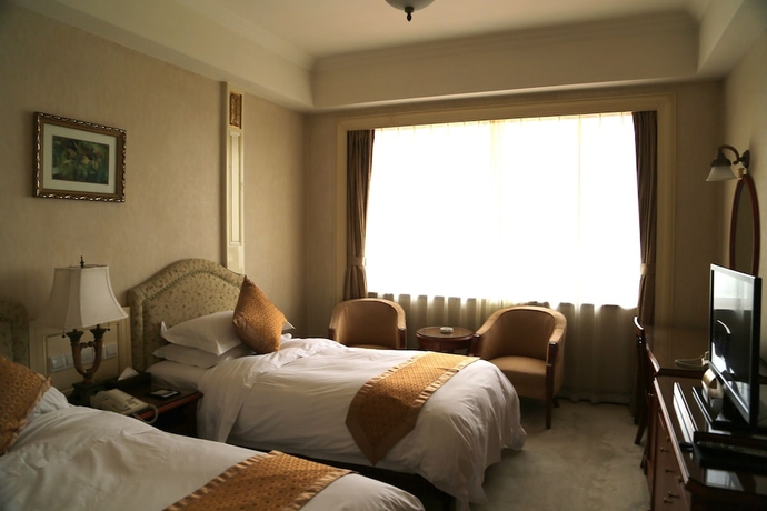 Imagen de la habitación del Hotel Huiquan Dynasty. Foto 4