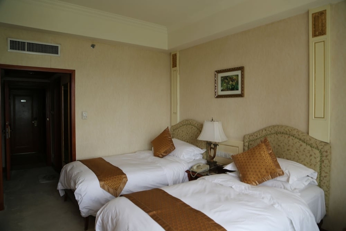 Imagen de la habitación del Hotel Huiquan Dynasty. Foto 10